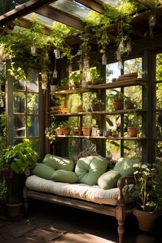 a bench with pillows and potted plants in the back ground, surrounded by greenery