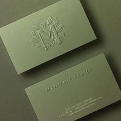 two business cards sitting on top of each other with the words madhat farm printed on them