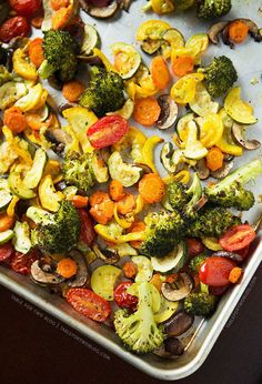 a pan filled with lots of veggies on top of a table