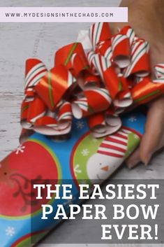 a person holding a paper bow on top of a skateboard with the words, the easier paper bow ever