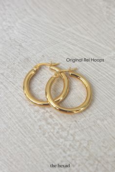 go-to classic hoop earrings that will never go wrong. ORIGINAL REI HOOPS by THE HEXAD JEWELRY Gold Hoop, Ear Studs, Gold Hoop Earrings, Ear Piercings, Favorite Jewelry, Everyday Essentials Products