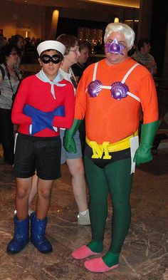 two people in costumes standing next to each other