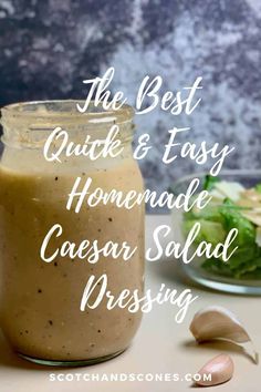 the best quick and easy homemade caesar salad dressing in a glass jar with garlic on the side