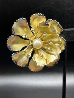 "Classy faux pearl goldtone brooch is so Mid Century! Just the right bit of sparkle to add to your little black dress.Measures aprox 2.25\". In excellent vintage condition, we also have other delightful vintage jewelry items coming soon!  I will accept no returns on purchases, please look carefully at the photos before you buy. Shipping with insurance is included, please allow 3 business days for processing. I only ship to the Continental US at this time. If you have any questions on this listing, do not hesitate to email me, I will do my best to answer them. Please look at my other listings, I will be adding more fantastic vintage finds from the 20s through the 70s weekly!!" The 20s, Vintage Telephone, Rhinestone Brooches, Vintage Finds, Vintage Silver, Turquoise Ring, Faux Pearl, Brooch Pin, Brooches