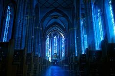 the inside of a church with stained glass windows