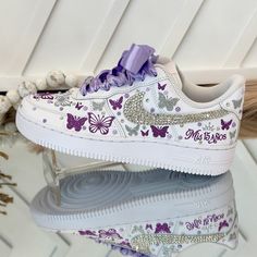 🌸 Step into your special celebration with style and grace, courtesy of our exquisite custom Nike shoes. These sneakers have been transformed to add a touch of elegance to your Sweet Sixteen or Quinceañera party, ensuring you stand out on your big day. 🌸 Who says sneakers can't be both chic and comfortable? We've redefined the rules! Our shoes are designed for dancing the night away without any discomfort. You can twirl and dance until dawn in absolute comfort. 🌸 Customization is at your fingertips! If you prefer a different color or design, simply let us know. We're here to bring your dream shoes to life. 👟 Designs and Texts: You can choose from our provided designs and texts in the personalization section or send us your own heartfelt message. ✨ RIBBON COLOR: If you'd like a different Quinceanera Shoes Purple, Sweet Sixteen Shoes, Quince Inspo Decor, Quince Sneakers, Quince Shoes Sneakers, Sweet 16 Shoes, Quince Shoes, Purple Sweet 16, Quinceanera Shoes