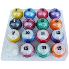 an assortment of colorful billiards with numbers on each one in the center, and eight