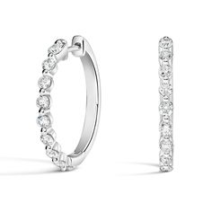 Luxe Marseille Diamond Hoop Ears - 18K White Gold. Stunning yet effortless, these beautiful hoop earrings feature glistening round diamonds in sophisticated shared prong settings (5/8 total carat weight). Classic Formal Huggie Earrings With Single Cut Diamonds, Classic Formal Diamond Huggie Earrings, Classic Diamond Huggie Earrings, Timeless Brilliant Cut Huggie Earrings For Formal Events, Timeless Brilliant Cut Huggie Earrings For Formal Occasions, Classic Hoop Diamond Earrings For Formal Occasions, Elegant Diamond White Huggie Earrings With Brilliant Cut, Formal Hoop Earrings With Single Cut Diamonds, Elegant White Hoop Huggie Earrings