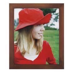 a woman wearing a red hat with long blonde hair