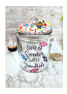 a glass jar filled with lots of colorful sprinkles