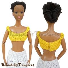 two dolls are wearing crocheted clothing and one has a yellow crop top on