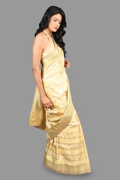 Gold banarasi handloom saree crafted in pure silk with bahar vine striped woven details. Comes with an unstitched blouse piece. - Aza Fashions Saree Gowns, Dhoti Saree, Cotton Sarees Handloom, Handloom Silk Saree, Ruffle Saree, Drape Saree, Lehenga Saree, Buy Gold, Banarasi Sarees