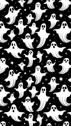 a black and white pattern with ghost faces on it's face, in the night sky