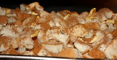 a pile of food sitting on top of a metal pan covered in powdered sugar