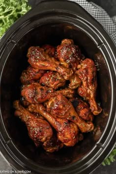 chicken wings in the crock pot ready to be cooked and put into the slow cooker