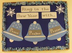 a bulletin board with three bells and snowflakes on it that says ring in the new year with peace, prayer, and praise