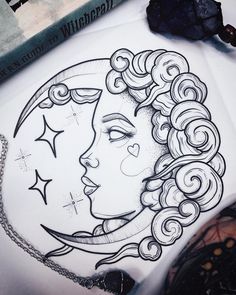 a drawing of a woman's face with the moon and stars on it