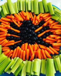 carrots, celery and black beans arranged in a circle