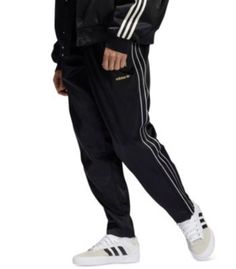 MSRP: $70.00 Take your sporty style and comfort to the next level with the soft satin and the iconic logo stripes of these Originals Firebird track pants from adidas. Shadow 3-stripes effect at sides; embroidered logo at left hip; adjustable leg openings with zipper closures Imported Two side hand pockets with zipper closures; back pocket Elastic waistband with drawstring closure Mid rise Size & Fit Regular fit Materials & Care Polyester Machine washable Iconic Logo, Adjustable Legs, Firebird, Sporty Style, Adidas Men, Track Pants, Mid Rise, Sweatpants, Track