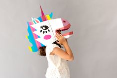 Surprise those around you with this XXL volume mask in fluorescent and luminous shades. In its large pocket, this cardboard mask delivered flat can be assembled by yourself. He can also be used as wall art for an original decoration in a bedroom, a hallway... Shark Mask, Cardboard Mask, Unicorn Mask, 3d Mask, Masks Crafts, Unicorn Costume, Deco Originale, Decoration Originale, 3d Wall Art