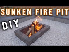 an outdoor fire pit made out of cinder blocks with flames coming out of the top