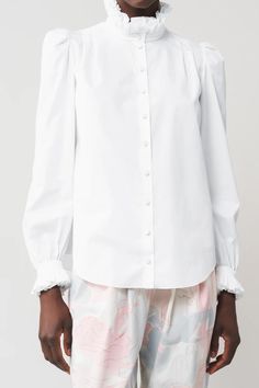 Cotton poplin blouse  gathered head sleeves  cuffs trimmed with double ruffles  double ruffle at the collar  shoulder dart pleats    100% cotton    dry clean Poplin Blouse, Black Crane, Blue Flats, Engineered Garments, Designer Outfits Woman, Dart, Cotton Poplin, Fabric Material, White Cotton