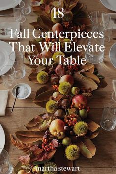 a long table with white plates and silverware on it, surrounded by fall centerpieces that will elevate your table