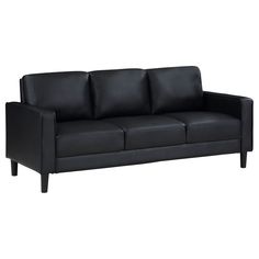 a black leather couch sitting on top of a white floor