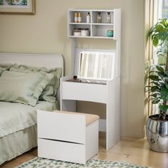 a bedroom with a bed, desk and shelves on the wall next to a plant