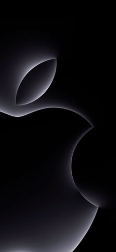 an apple logo is shown in this black and white photo, with light swirling around it