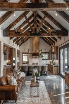 a living room filled with furniture and wooden beams