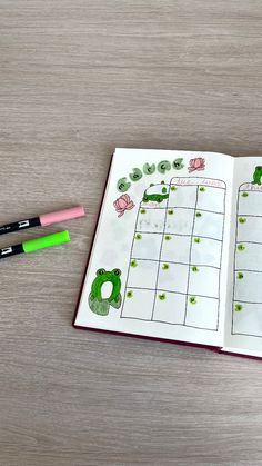 an open planner with green plants and cars on it