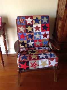 a chair that has a quilt on it