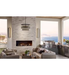 a living room filled with furniture and a fire place in front of a window overlooking the ocean