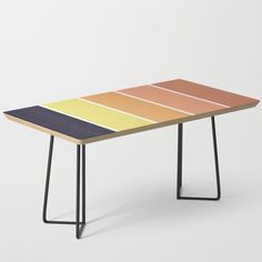 a multicolored wooden table with black metal legs on an isolated white background,