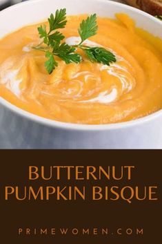 a bowl of butternut pumpkin bisque with bread in the background and text overlay that reads, butternut pumpkin bisque