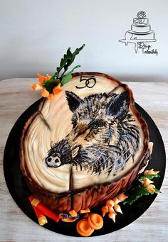 a cake with an image of a pig on it's face and flowers around the edges