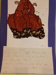 a child's drawing of a hippo sitting on top of a pile of paper