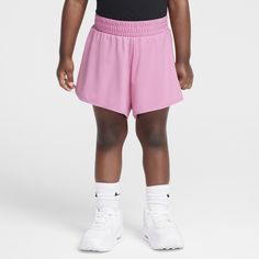 Little ones can get into the swing of these shorts, made of soft stretch poly jersey in a flowy cut that creates the illusion of a skirt. The stretch waistband provides a comfy fit, splits at the outer sides provide freedom of movement and built-in undershorts provide full coverage. Both layers of these shorts are boosted with quick-drying, moisture-wicking Dri-FIT technology to help kids stay cool and dry for all day play. Spring Pink 4-way Stretch Shorts, Nike Stretch Short Skort, Nike Sporty Short Skort, Spring Athletic Shorts With 4-way Stretch, Nike 4-way Stretch Shorts With Built-in Liner, Nike 4-way Stretch Shorts With Built-in Shorts, Spring Shorts With Elastic Waistband And 4-way Stretch, Nike Stretch Athletic Shorts For Summer, Nike Stretch Athletic Shorts With Elastic Waistband