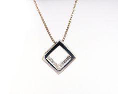 Feeling square? Make a statement with this unusual necklace. Forming part of my cube collection, this necklace incorporates the first cube that I designed in 3D to start this collection. This can be worn with any length chain (choose from the drop down) and makes a great stacking chain as you can see in the photos.Forming part of the cube collection by Silver Sculptor, this necklace comes in various chain lengths.The Cube Collection has been created by marrying traditional silversmithing with mo Unusual Necklace, Cube Necklace, Handcrafted Silver Jewelry, 3d Cube, Modern Necklace, Minimal Necklace, Contemporary Pendant, Geometric Necklace, Modern Necklaces