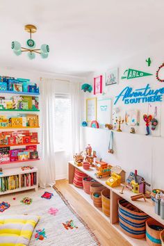 a child's playroom with bookshelves and toys