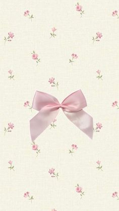 a wallpaper with pink flowers and a large bow on it's front side