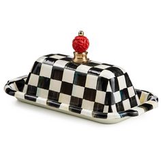 a black and white checkered box with a red top on it's lid