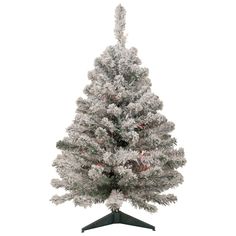 a white christmas tree on a black stand