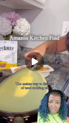 an image of a woman in the kitchen making something on her plate and looking at the camera