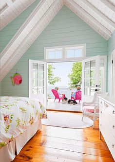 a bedroom with blue walls and white furniture