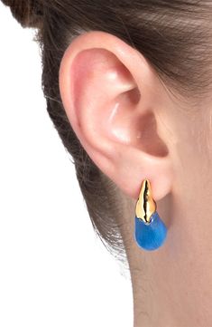 Molten caps plated in gleaming 14-karat gold enhance the shine of sculptural Lucite drop earrings with a luminous hand-painted finish. 1" drop; 1/2" width Post back Lucite/14k-gold plate Imported Modern Gold Enamel Earrings, Modern Gold Earrings With Enamel, Blue Polished Drop Earrings, Blue Drop Earrings With Polished Finish, Alexis Bittar, Fabric Gift Bags, Fabric Gifts, Anniversary Sale, Free Fabric