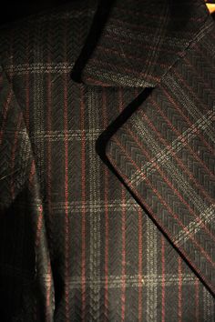 "This is a Black Plaid Mod Fitted Swinging 60's wool (I believer) suit. Tailored in California by Lewis Roth for Julius Lewis of Memphis TN. It is a plaid about the size of a Window Pane Check. It has a 3D hounds tooth pattern running through the black. The other colors are a Grey and Red. There is a great Jacket cuff detail like the end is folded over. The Pants are matching Flat Front with a 60's style built in buckle belt style closure It is a men's size 40 but please check the measurements T Vintage Leather Vest, Tooth Pattern, 60's Style, Swinging 60s, Hounds Tooth, Memphis Tn, Belt Style, Window Pane, Cuff Detail