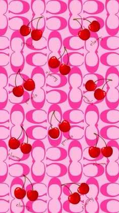 a pink background with cherries on it