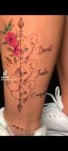 a woman's thigh with flowers and arrows on her side, which reads david jaden